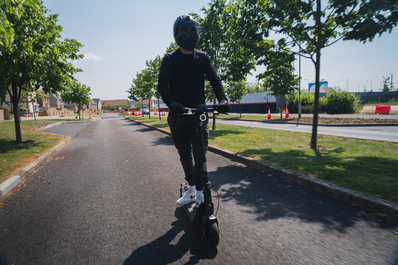 Josh Riding the NIU KQi3 Pro Down a Street