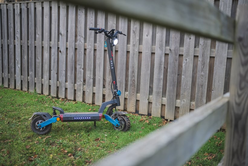 Varla Eagle One V2 Against a Fence